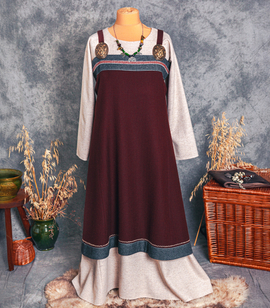 Hand-embroidered Scandinavian wool apron dress with handwoven trim